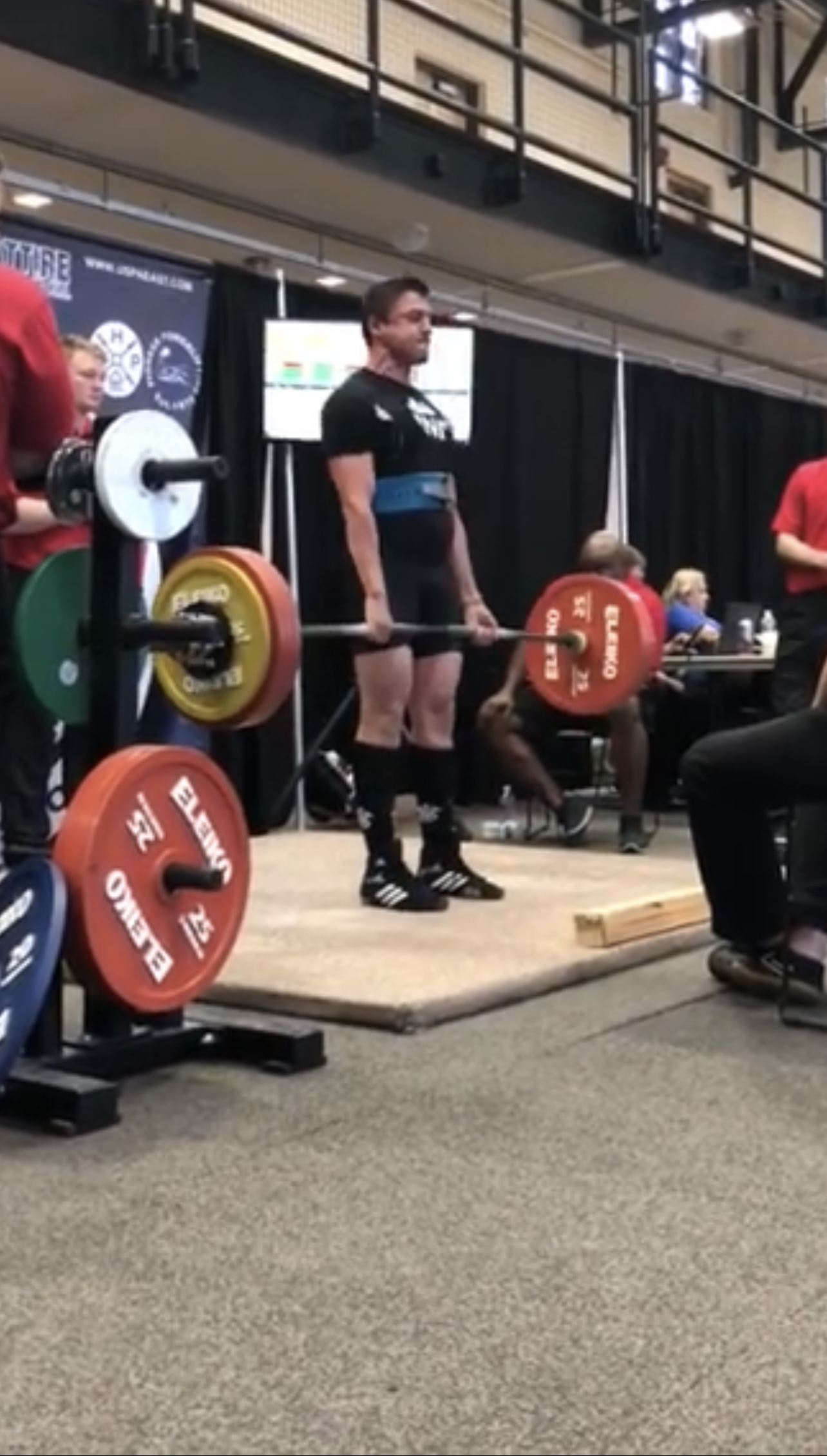 Alex competing in powerlifting